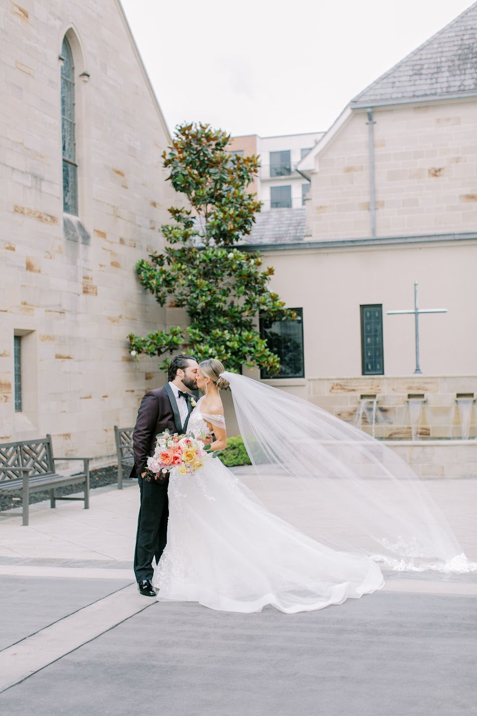 Bride and groom kissing